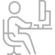 person working at desk icon